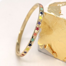 Golden Finish Bangle with Inset Enamel Stars by Peace of Mind
